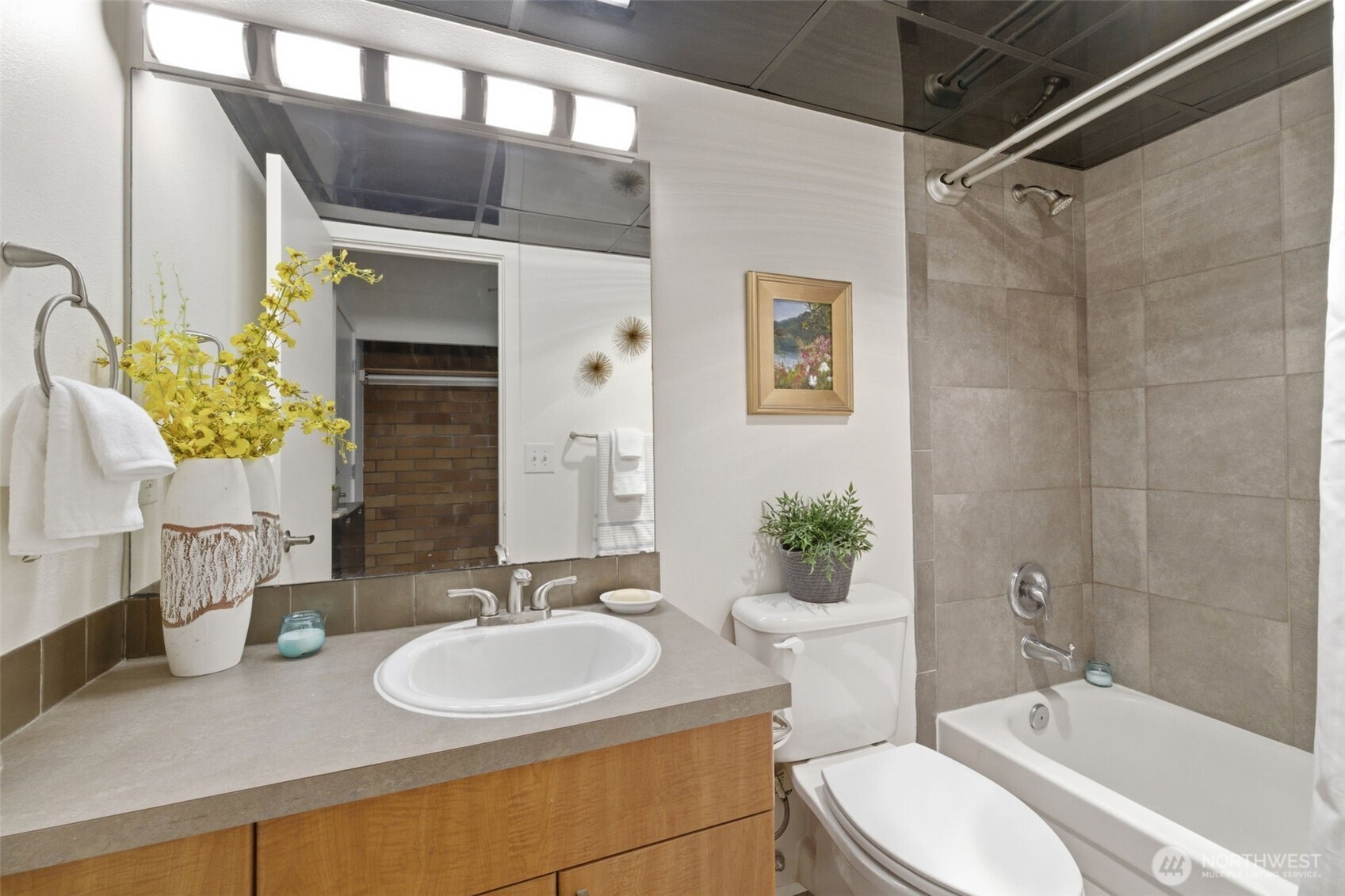 905 Cherry Street, Unit 306 Seattle, WA 98104 - Photo 14 of 25 a bathroom with a sink a toilet and shower