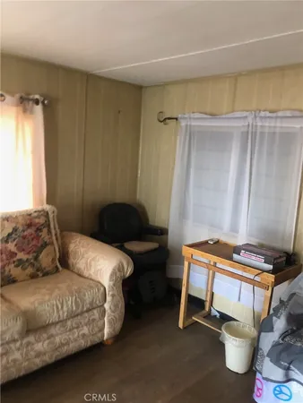 a bedroom with a bed and a table