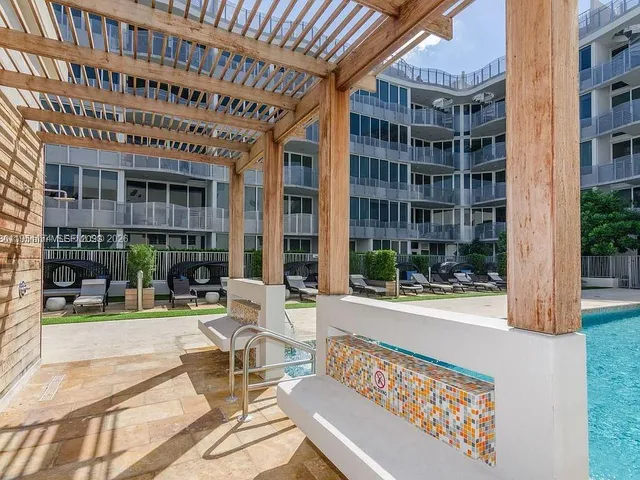 a view of a building with sitting area