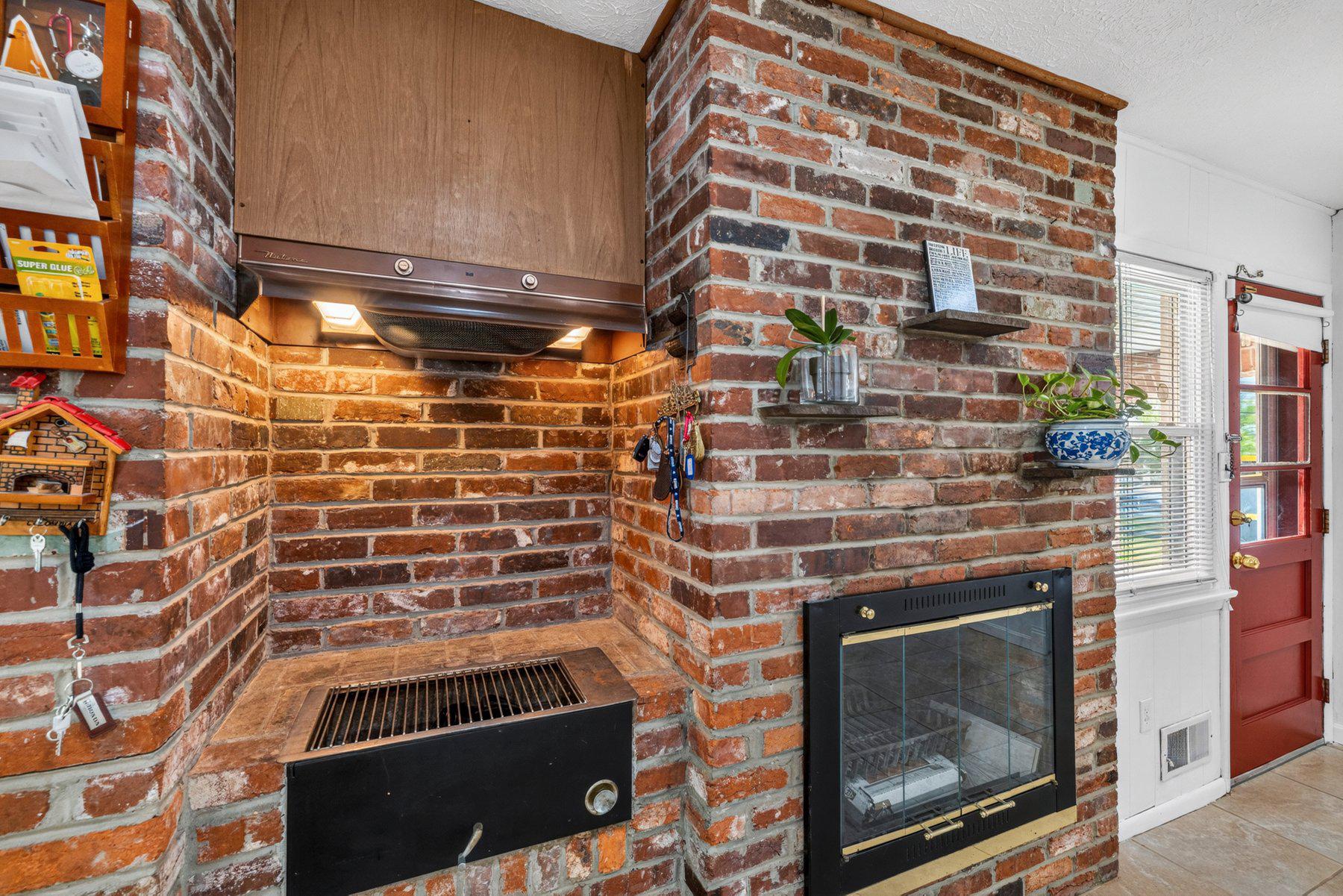 2311 Coleridge Drive Silver Spring, MD 20910 - Photo 12 of 47 Charming brick fireplace and charcoal grill.