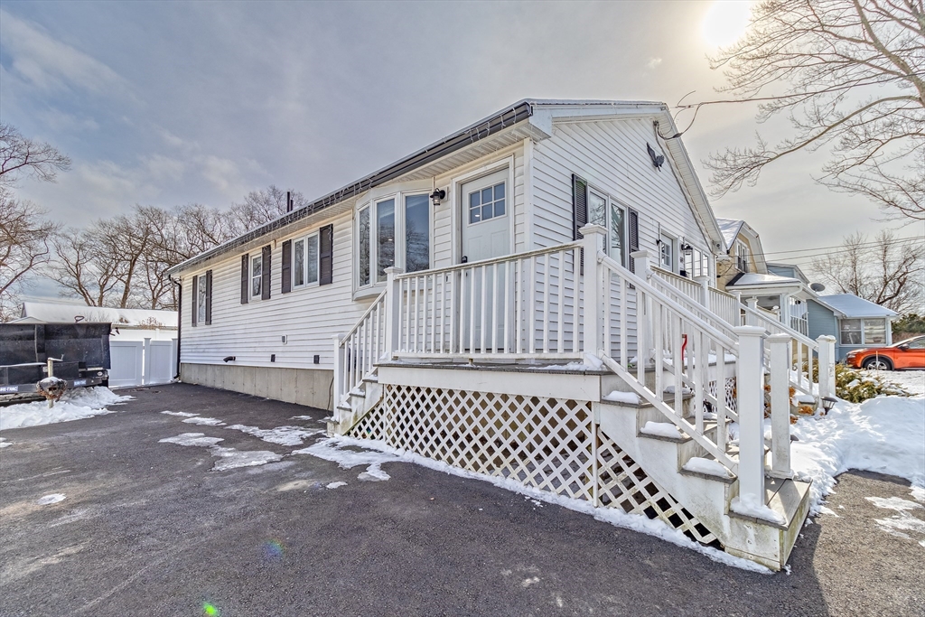 69 Rochester Street Chicopee, MA 01020 - Photo 3 of 34 a view of a house with a yard