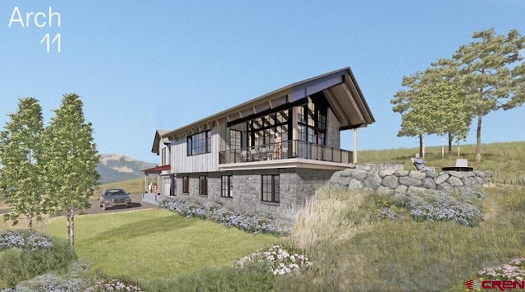 565 Saddle Ridge Ranch Road Crested Butte, CO 81224 - Photo 15 of 35 a balcony with table and chairs and wooden fence