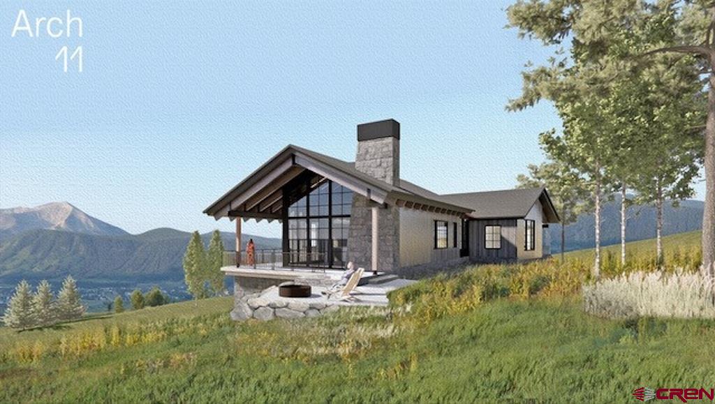 565 Saddle Ridge Ranch Road Crested Butte, CO 81224 - Photo 17 of 35 a view of a house with a small yard and furniture