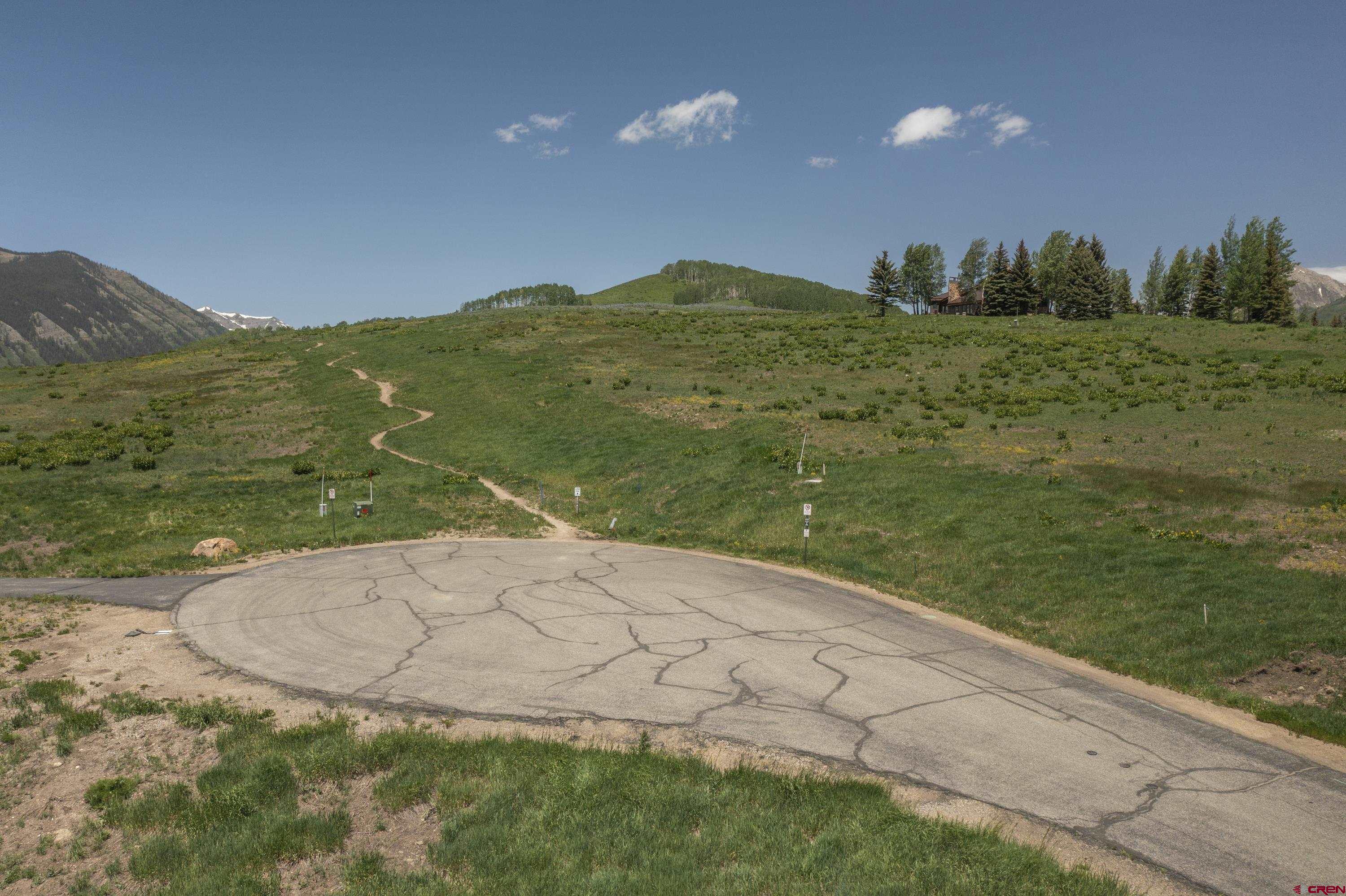 565 Saddle Ridge Ranch Road Crested Butte, CO 81224 - Photo 22 of 35 a view of a field with an ocean view