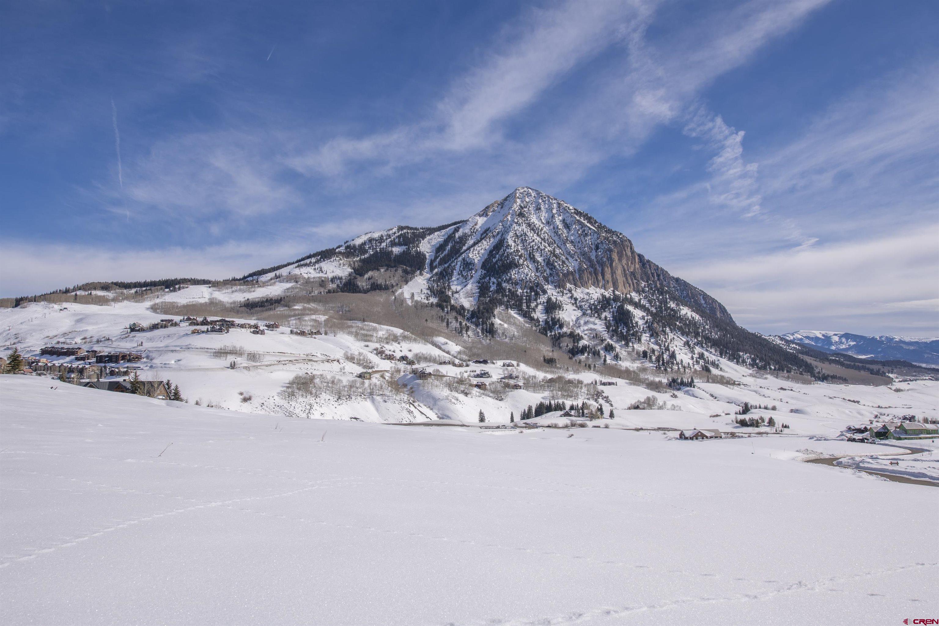 565 Saddle Ridge Ranch Road Crested Butte, CO 81224 - Photo 6 of 35 a view of a wooden floor with a snow in the background