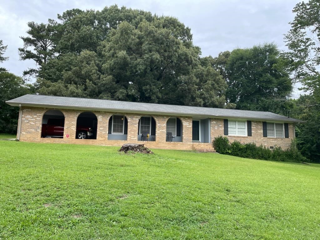 2844 Middlesex Court Southwest Snellville, GA 30078 - Photo 1 of 1 a front view of house with yard and green space