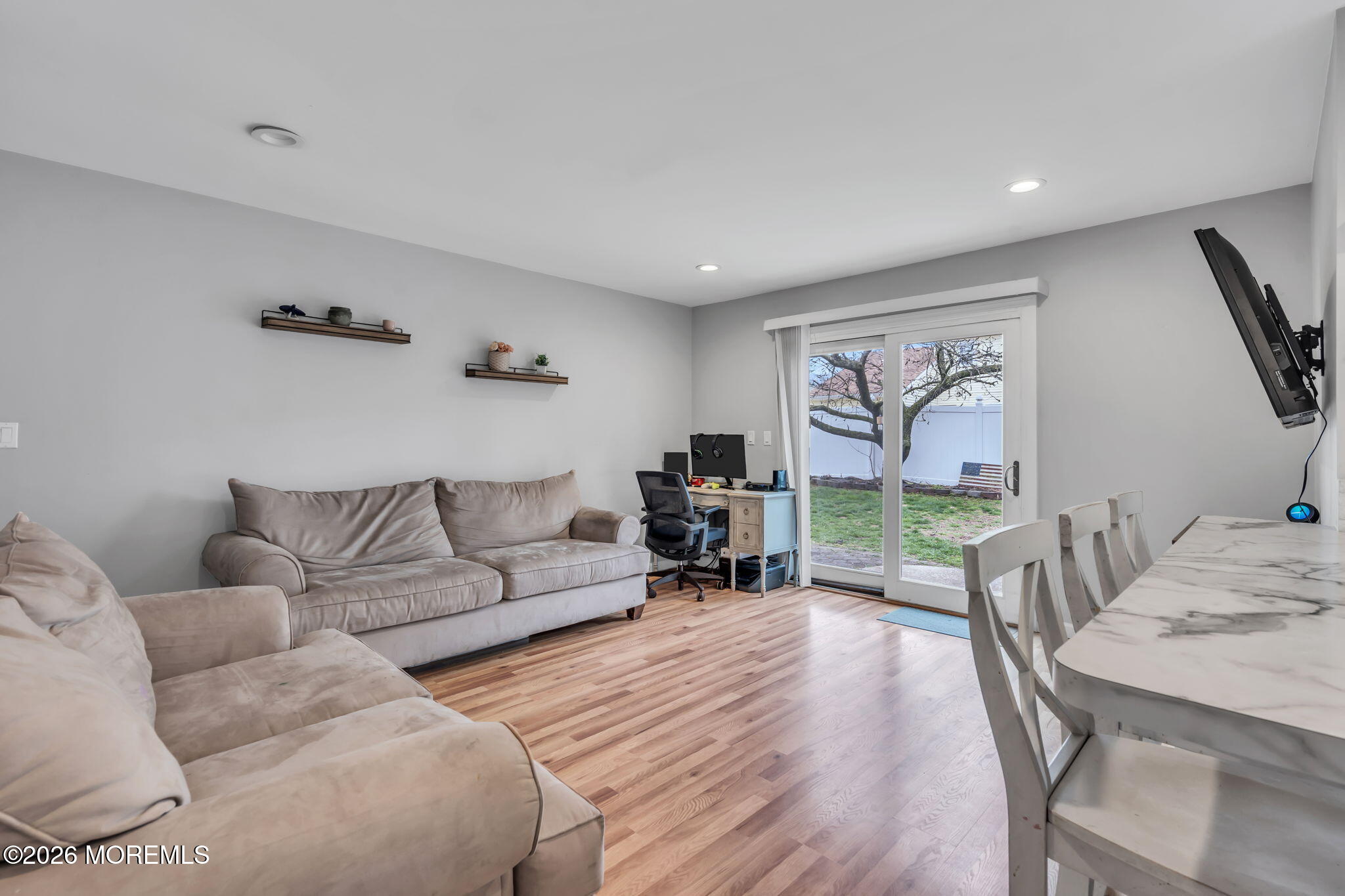 24 Eric Drive Howell, NJ 07731 - Photo 25 of 58 a living room with furniture and a flat screen tv
