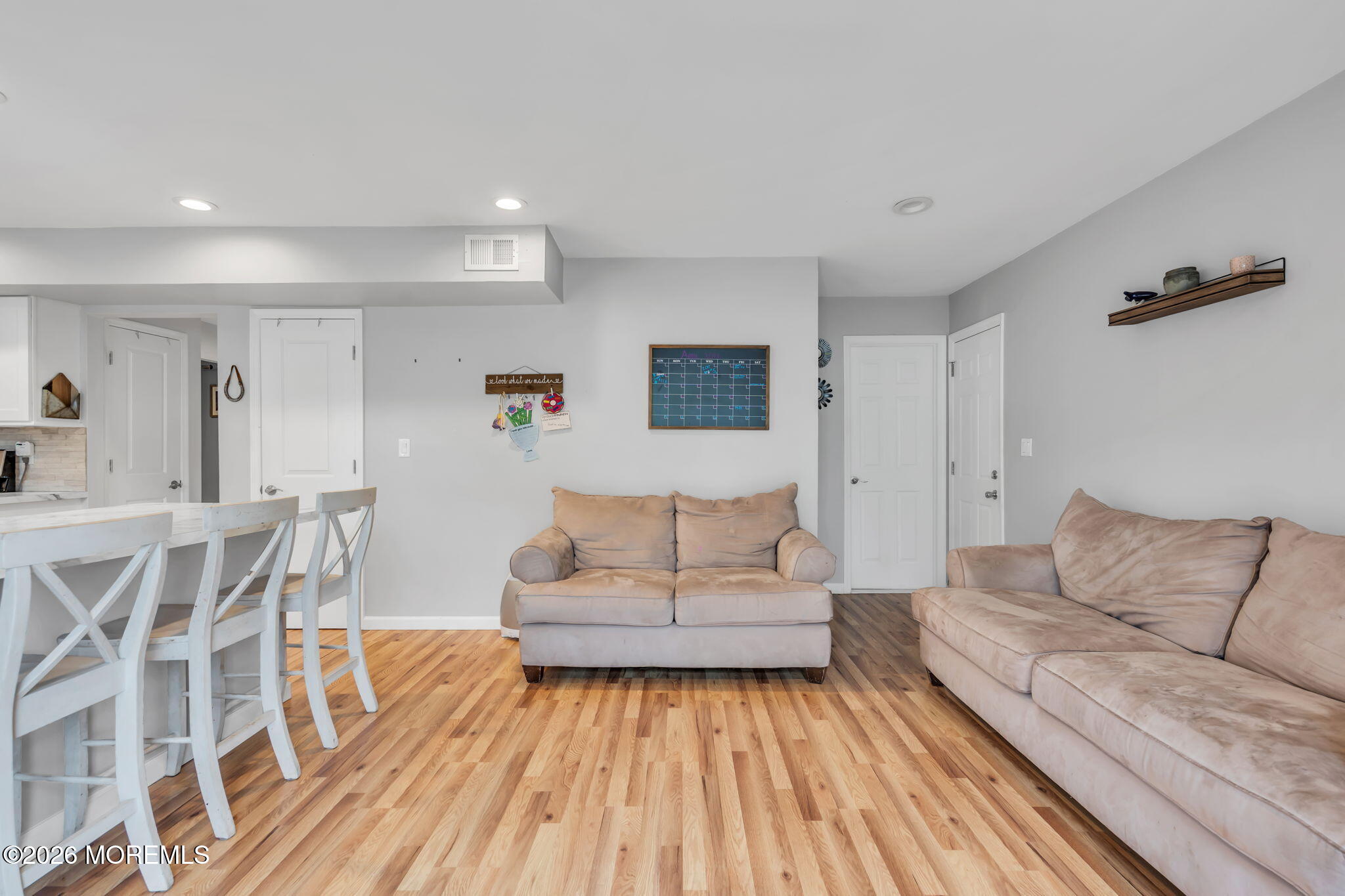 24 Eric Drive Howell, NJ 07731 - Photo 27 of 58 a living room with furniture and a wooden floor