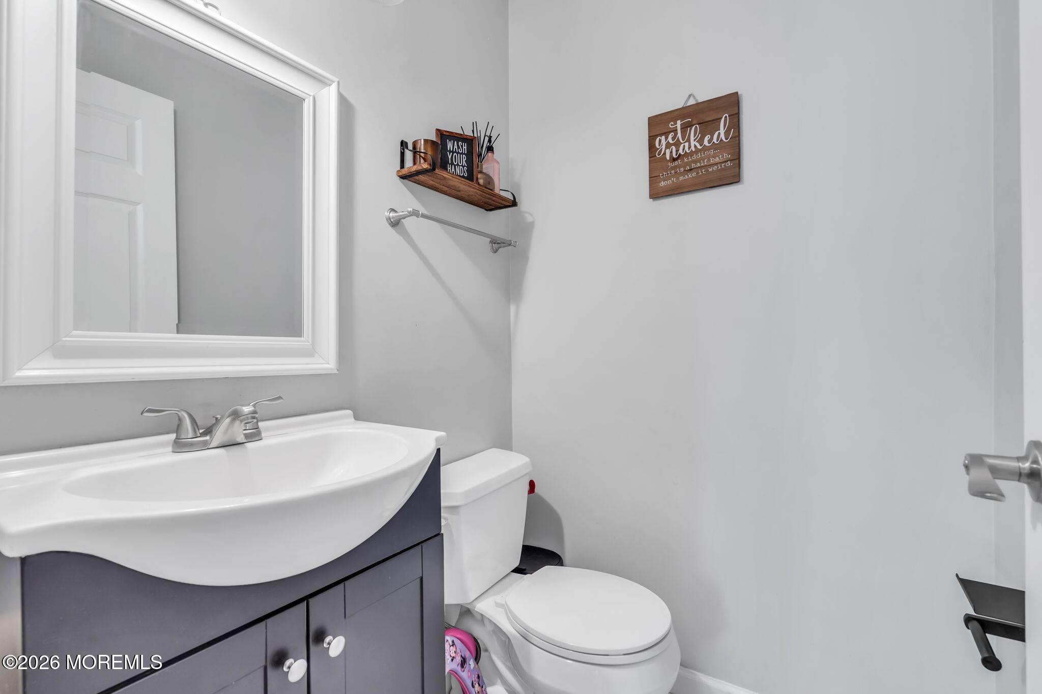 24 Eric Drive Howell, NJ 07731 - Photo 29 of 58 a bathroom with a sink mirror and toilet