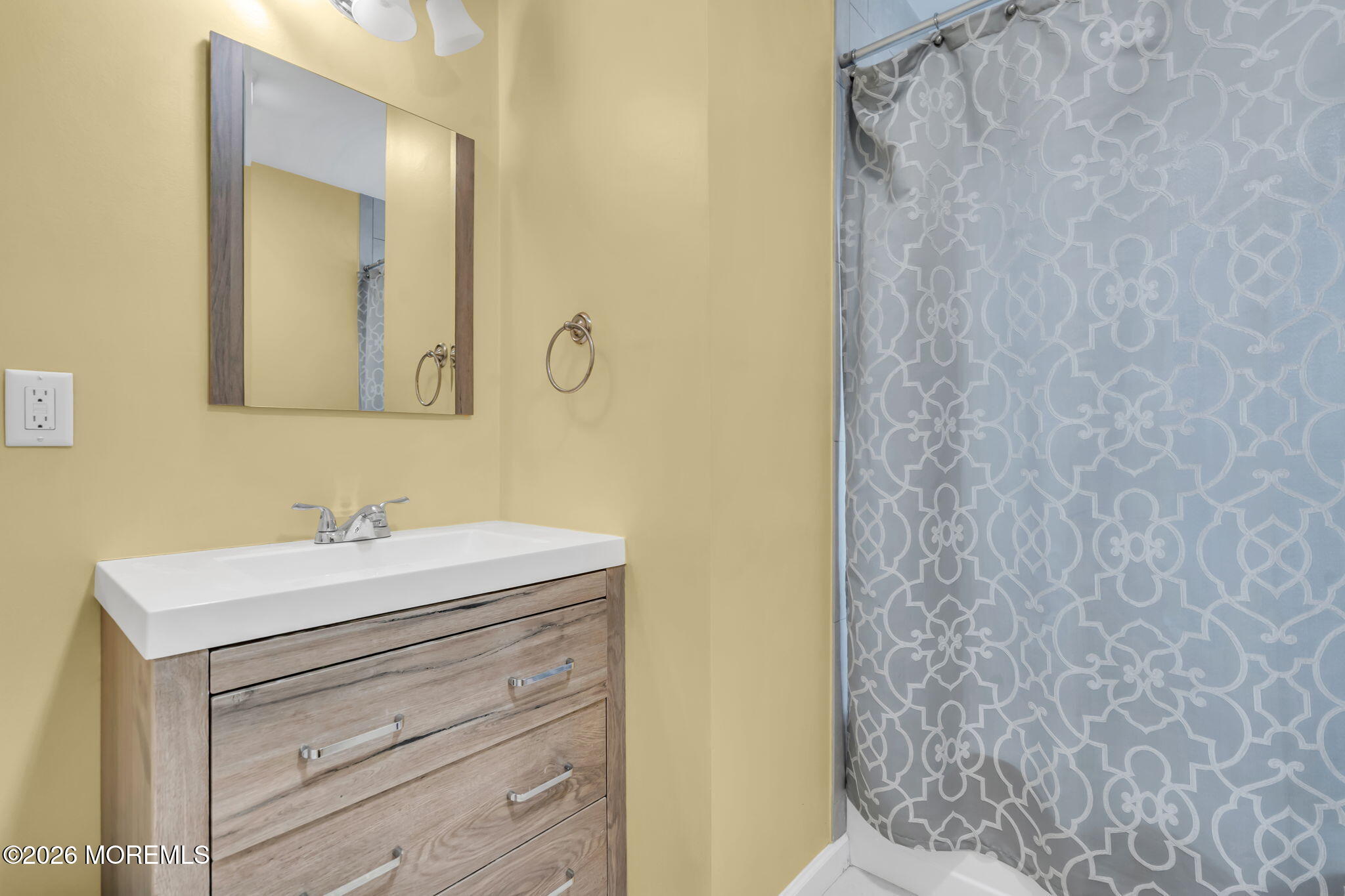 24 Eric Drive Howell, NJ 07731 - Photo 34 of 58 a bathroom with a sink and a mirror