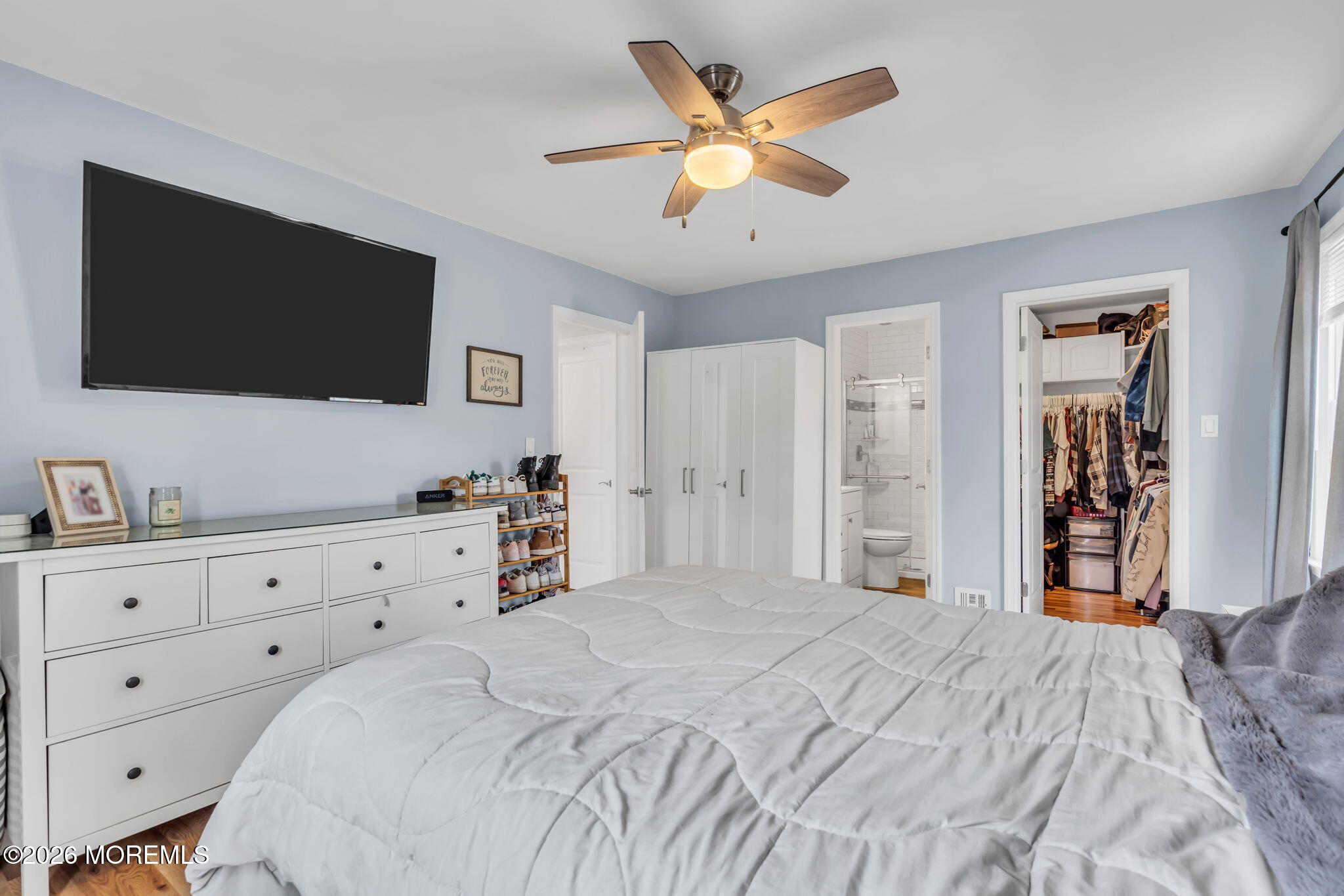 24 Eric Drive Howell, NJ 07731 - Photo 36 of 58 a bedroom with a bed and a flat screen tv
