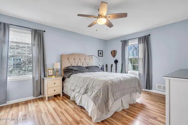 a bedroom with a large bed and a window