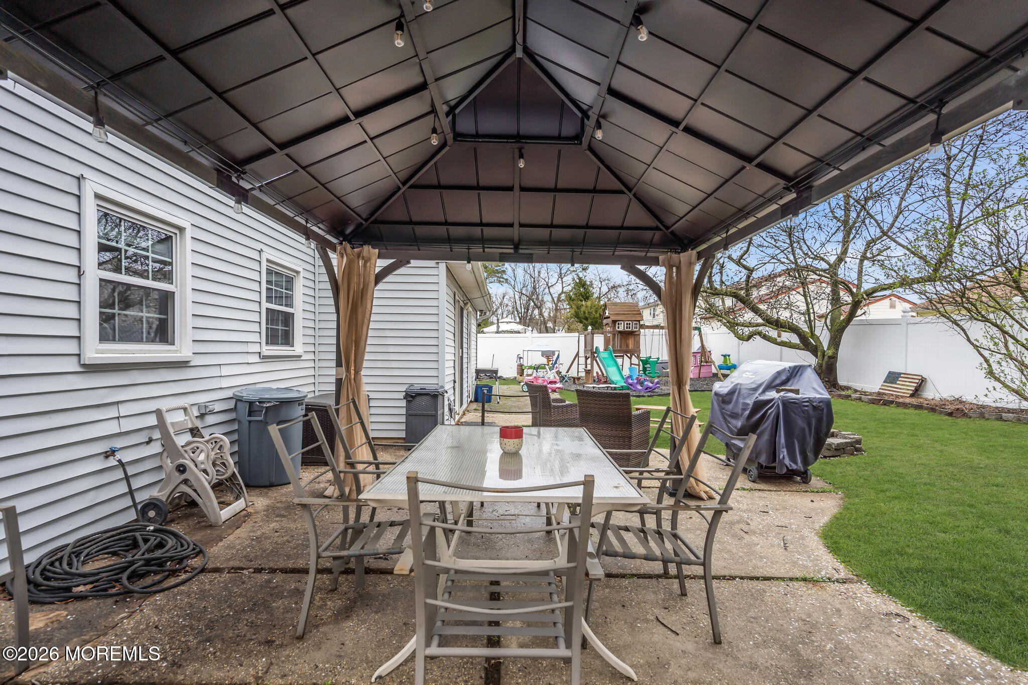 24 Eric Drive Howell, NJ 07731 - Photo 46 of 58 a table and chairs in the garden