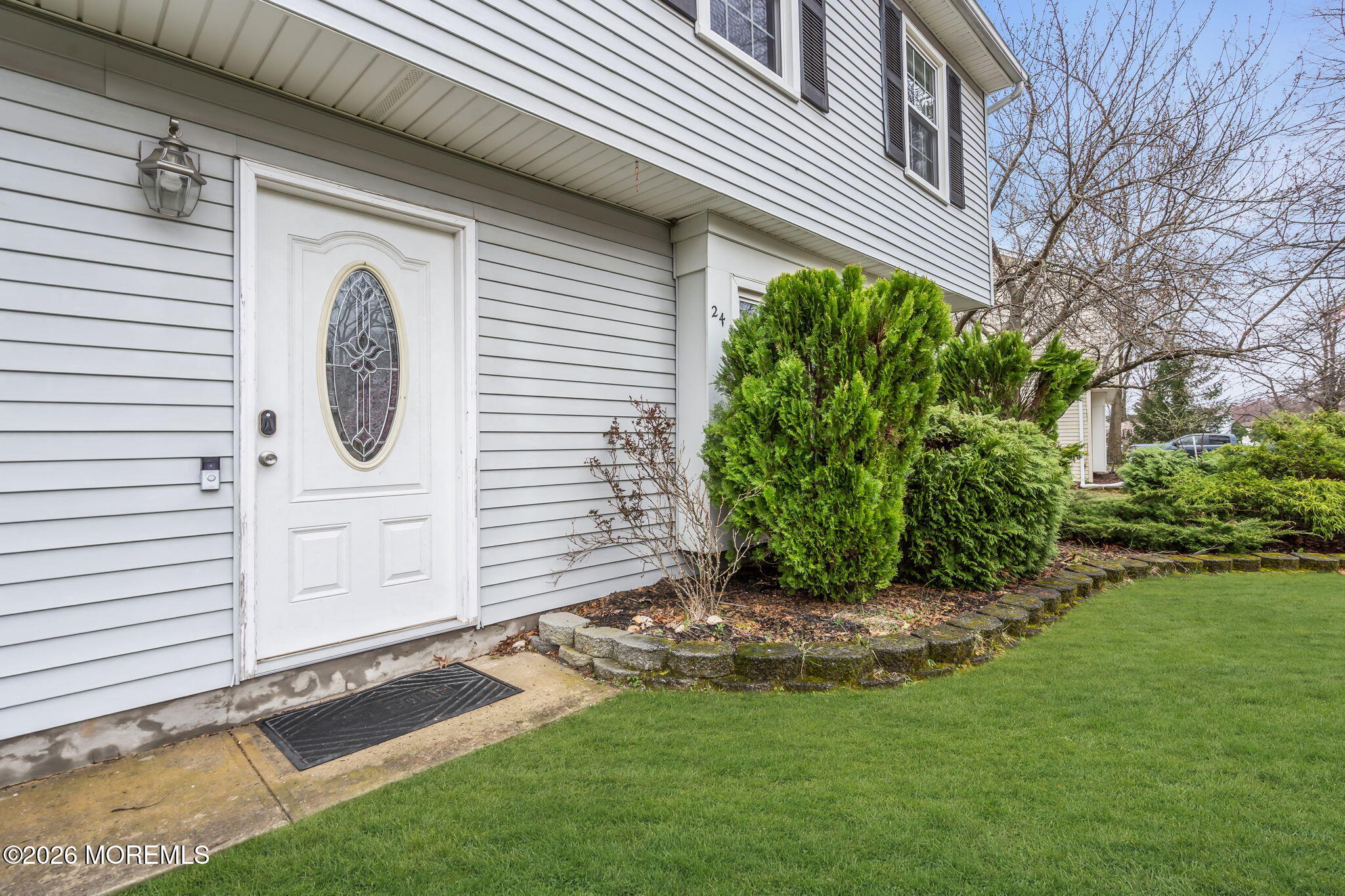24 Eric Drive Howell, NJ 07731 - Photo 50 of 58 a front view of a house with garden