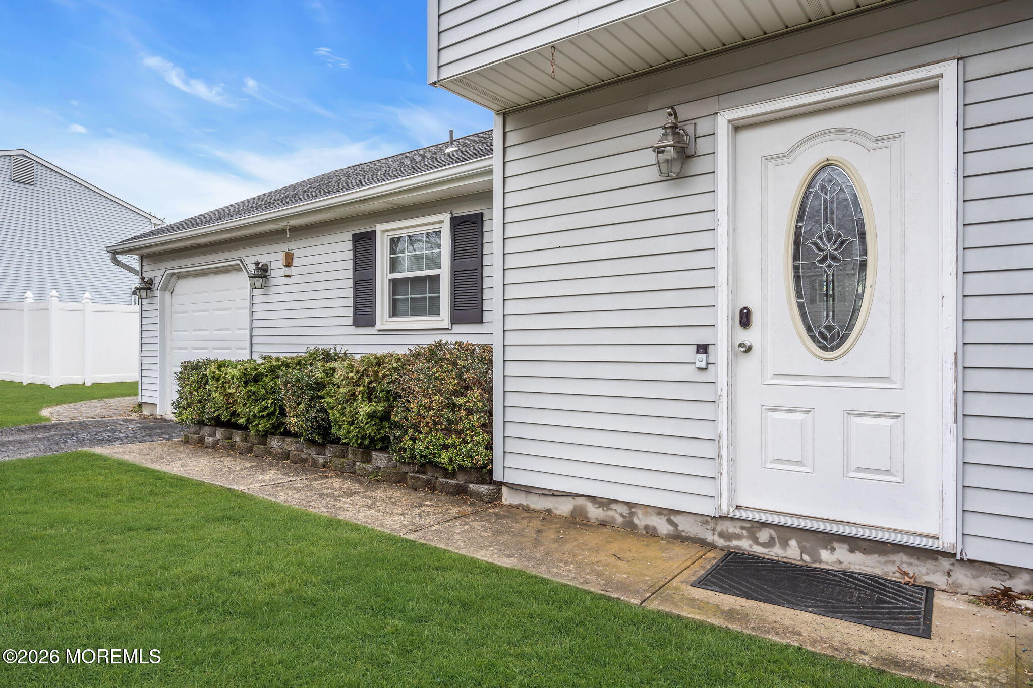 24 Eric Drive Howell, NJ 07731 - Photo 6 of 58 a front view of a house with a yard