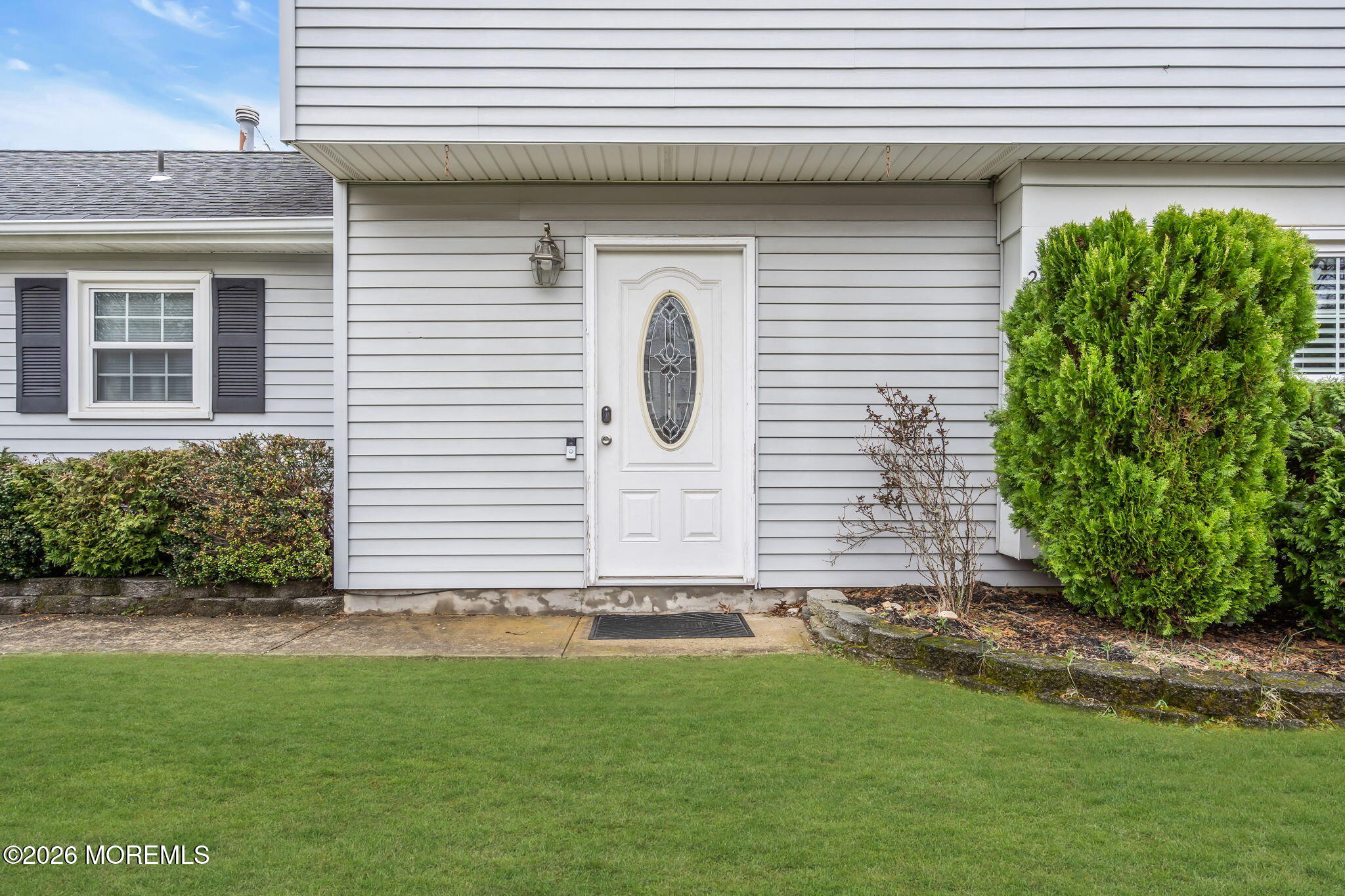 24 Eric Drive Howell, NJ 07731 - Photo 7 of 58 a front view of a house with a yard