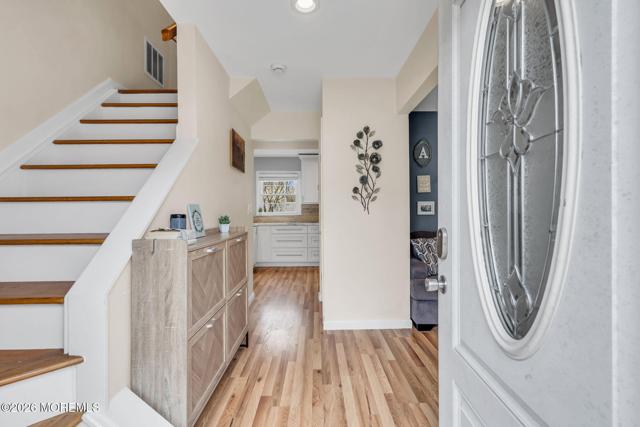 24 Eric Drive Howell, NJ 07731 - Photo 9 of 58 a view of a hallway with wooden floor and entryway