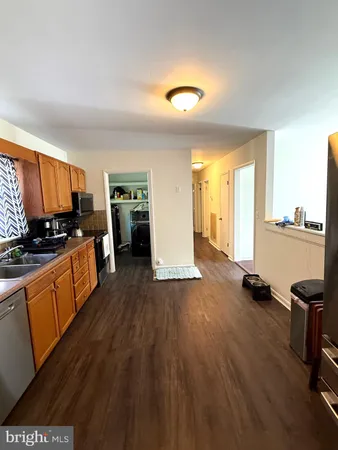 a large kitchen with lot of cabinets and appliances