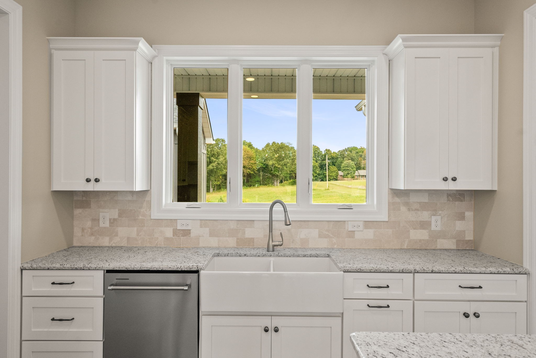 4108 Old Coopertown Road Springfield, TN 37172 - Photo 16 of 39 a kitchen with stainless steel appliances granite countertop white cabinets and a window
