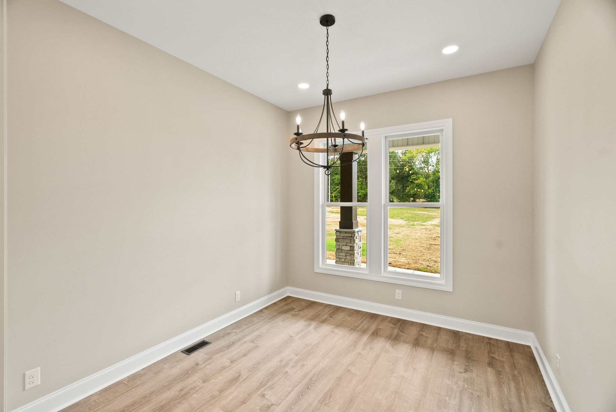 4108 Old Coopertown Road Springfield, TN 37172 - Photo 19 of 39 a view of an empty room with a window and wooden floor