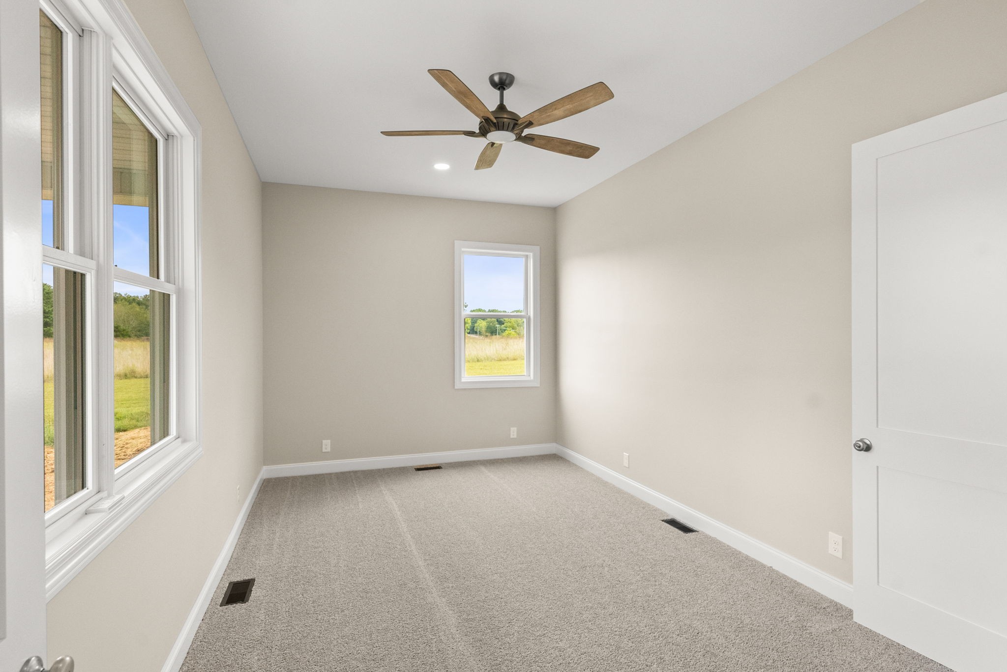 4108 Old Coopertown Road Springfield, TN 37172 - Photo 33 of 39 an empty room with a window and a ceiling fan