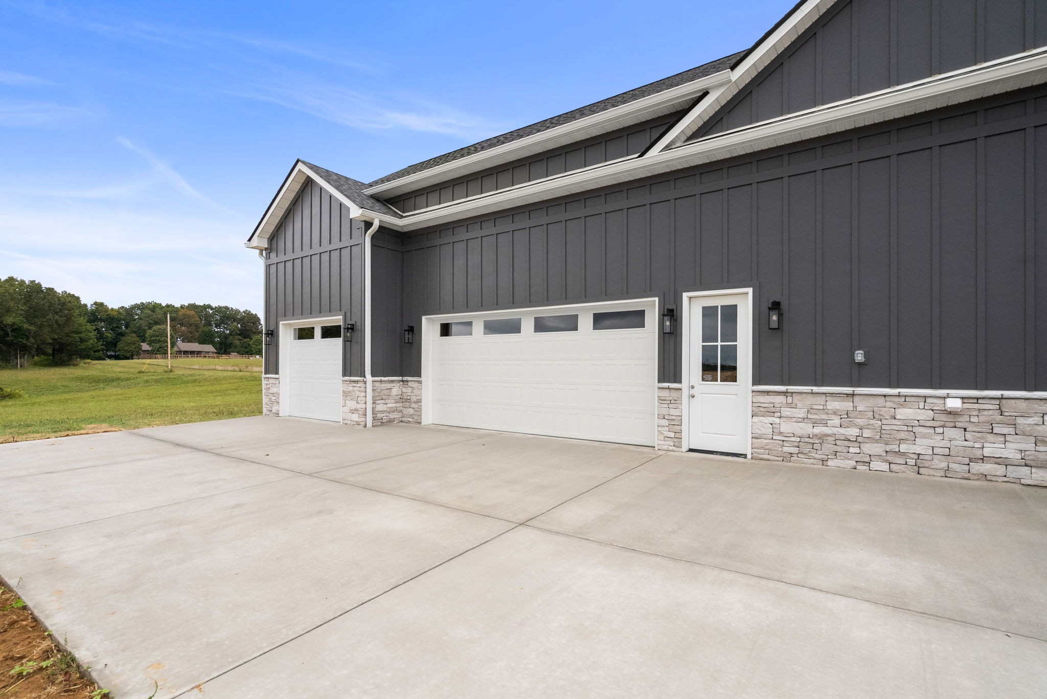 4108 Old Coopertown Road Springfield, TN 37172 - Photo 38 of 39 a view of a house with backyard and a garage