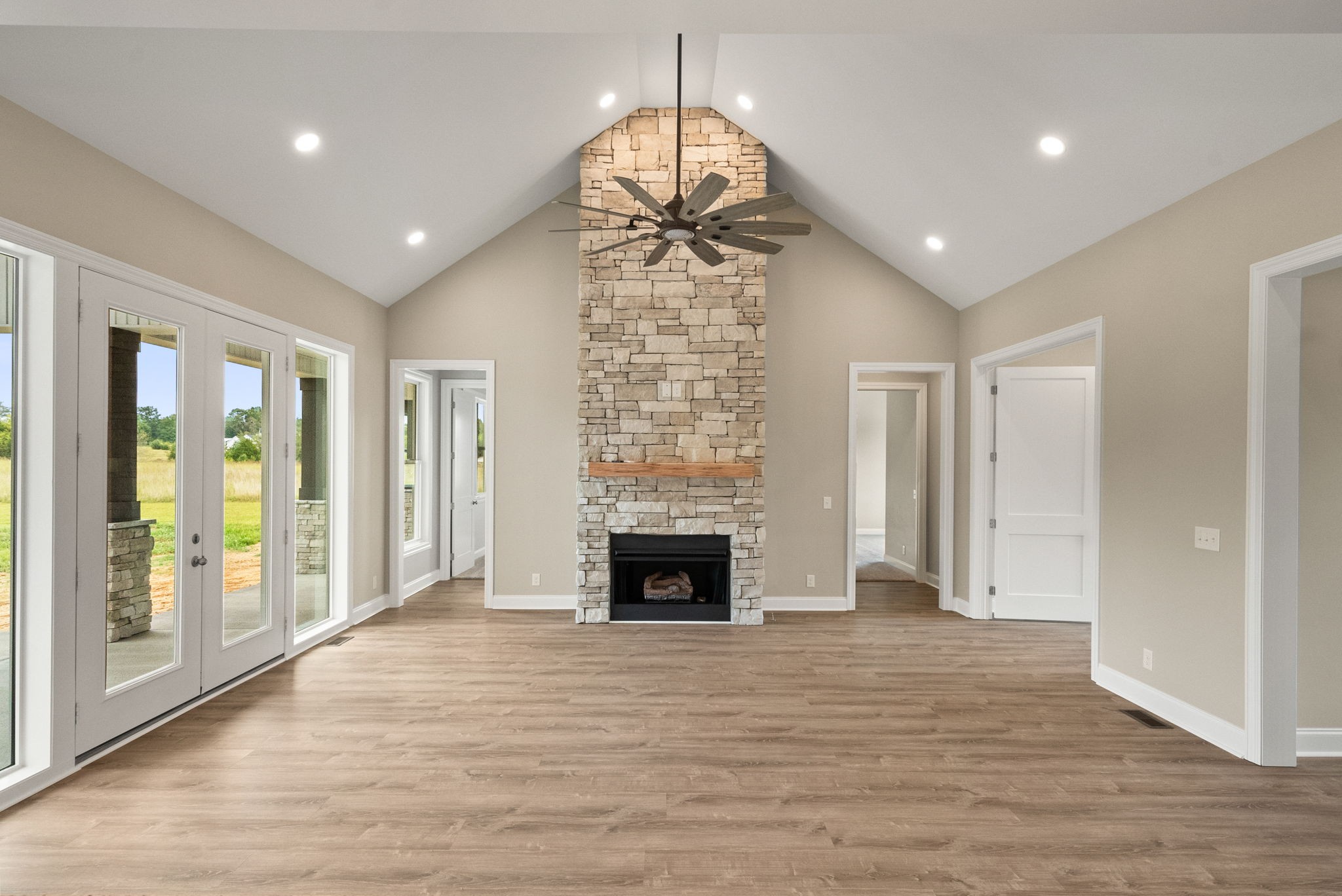 4108 Old Coopertown Road Springfield, TN 37172 - Photo 8 of 39 a view of empty room with wooden floor and fireplace