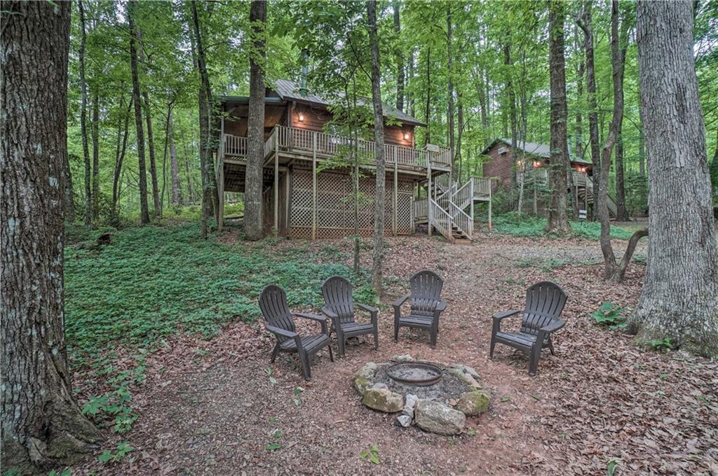 a backyard of a house with table and chairs