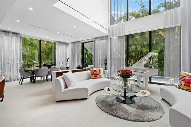 a living room with patio furniture and a fountain