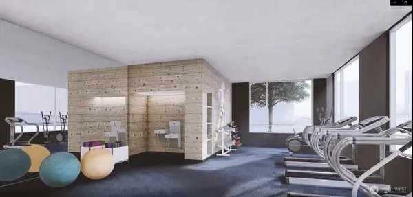 a view of a living room with a floor to ceiling window and wooden floor