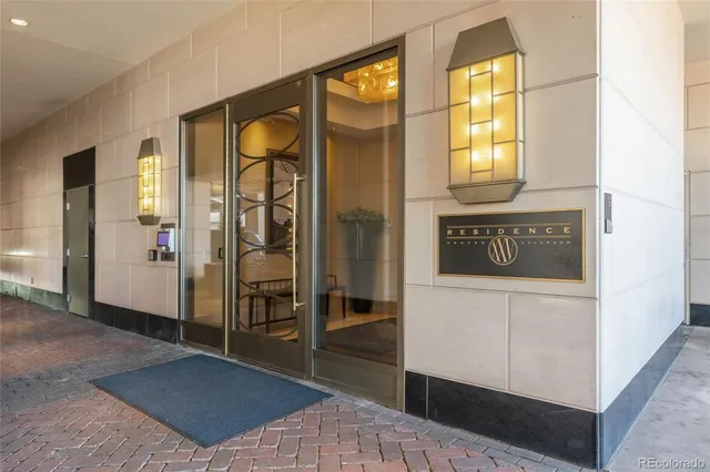 a view of a livingroom with furniture and a chandelier