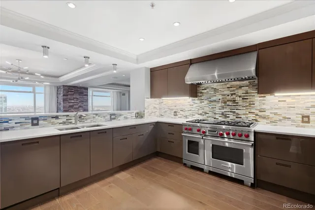 a kitchen with stainless steel appliances and wooden cabinets