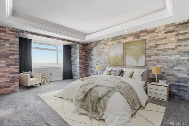 a bedroom with a bed and a couch