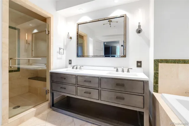 a bathroom with a sink double vanity and a mirror