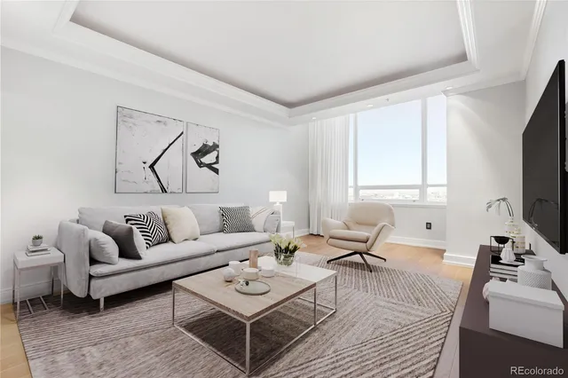 a living room with furniture a rug and a window