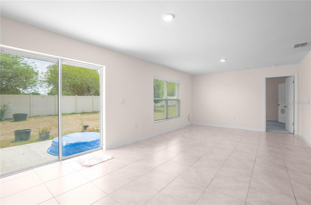 8471 Clearway Drive Wildwood, FL 34785 - Photo 11 of 32 a view of an empty room with window