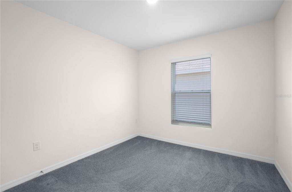 8471 Clearway Drive Wildwood, FL 34785 - Photo 18 of 32 a view of a room that has a window in it