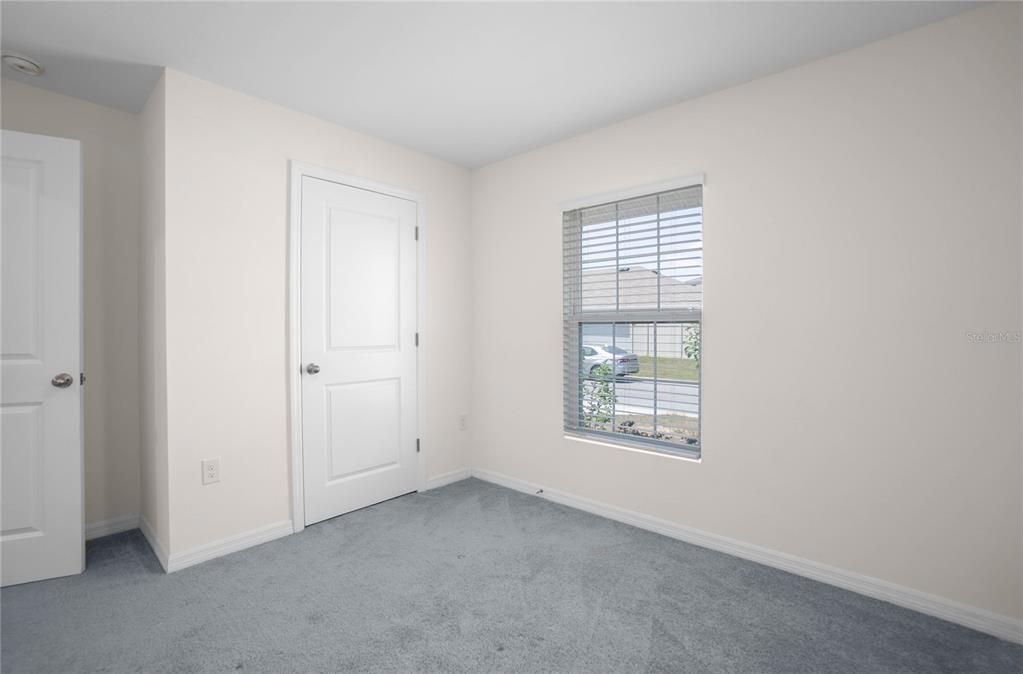 8471 Clearway Drive Wildwood, FL 34785 - Photo 21 of 32 an empty room with a window