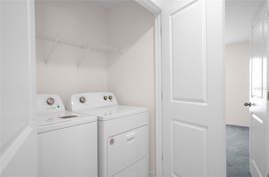 8471 Clearway Drive Wildwood, FL 34785 - Photo 22 of 32 a utility room with dryer and washer