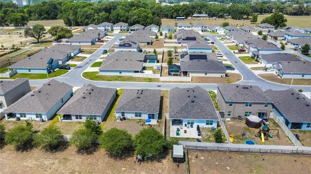 an aerial view of a house with a garden
