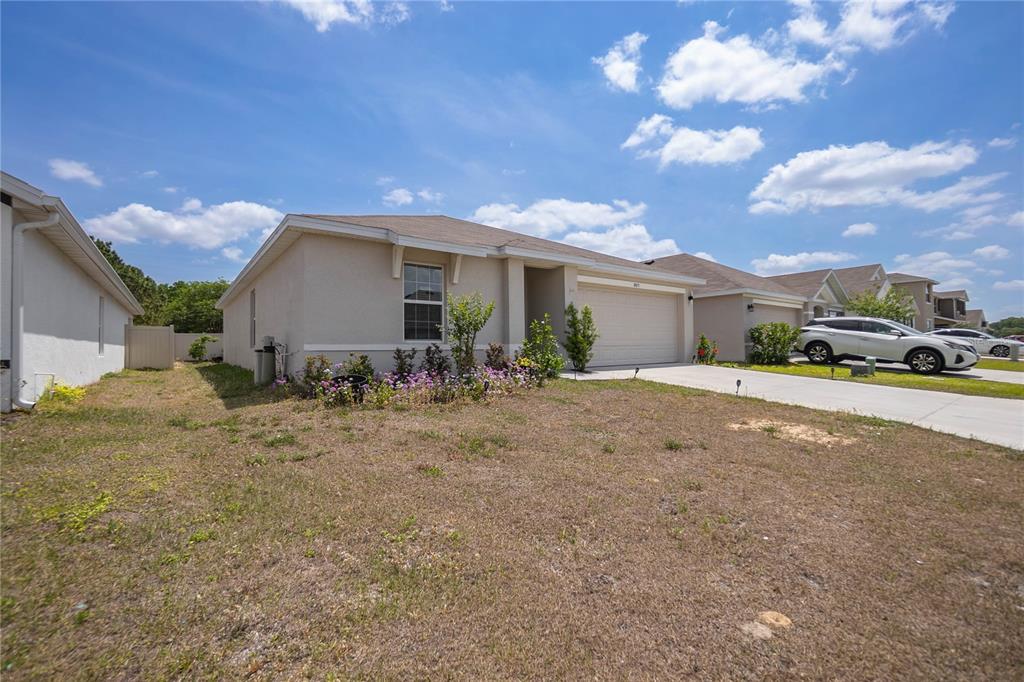8471 Clearway Drive Wildwood, FL 34785 - Photo 4 of 32 a view of a house with a patio