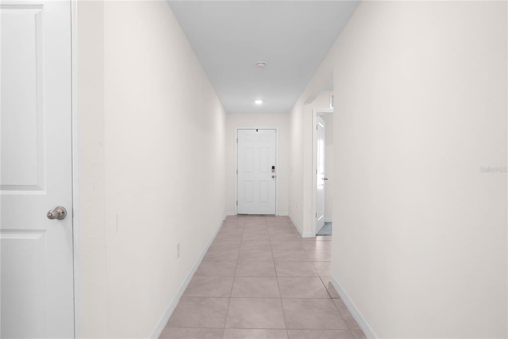8471 Clearway Drive Wildwood, FL 34785 - Photo 5 of 32 a view of a hallway