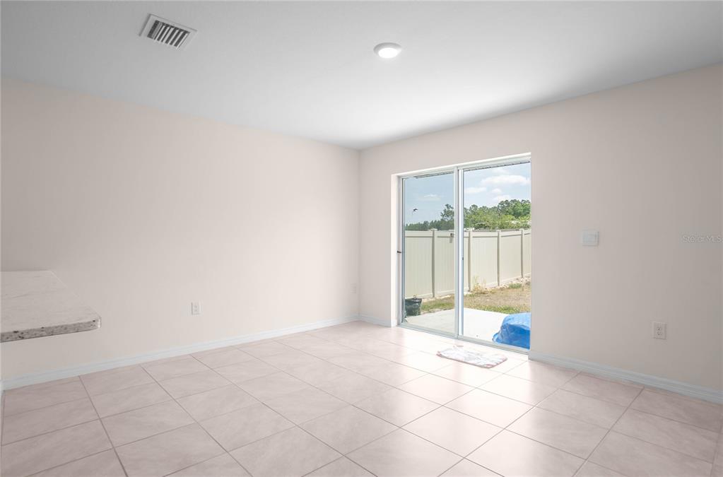 8471 Clearway Drive Wildwood, FL 34785 - Photo 10 of 32 a view of an empty room and a window