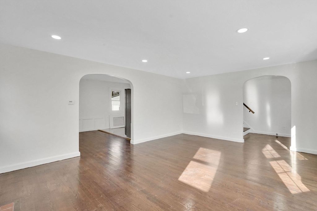 100 Abbott Street Springfield, MA 01118 - Photo 13 of 31 a view of an empty room with wooden floor and a window