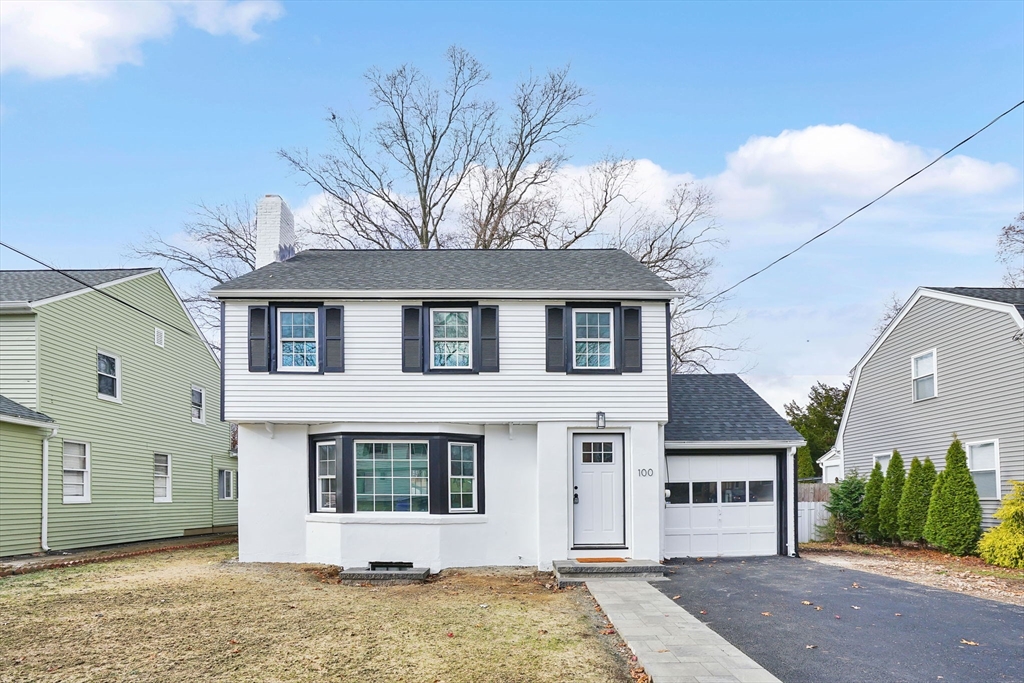 100 Abbott Street Springfield, MA 01118 - Photo 2 of 31 a front view of a house with a yard