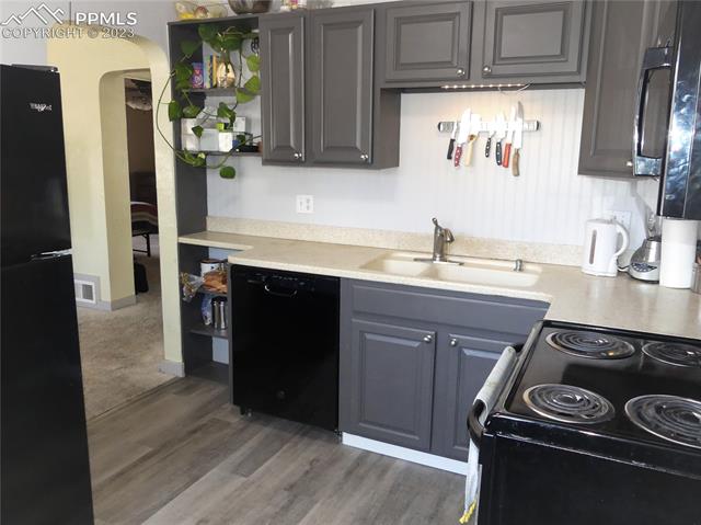 811 Prairie Road Colorado Springs, CO 80909 - Photo 11 of 28 Luxury vinyl plank in kitchen