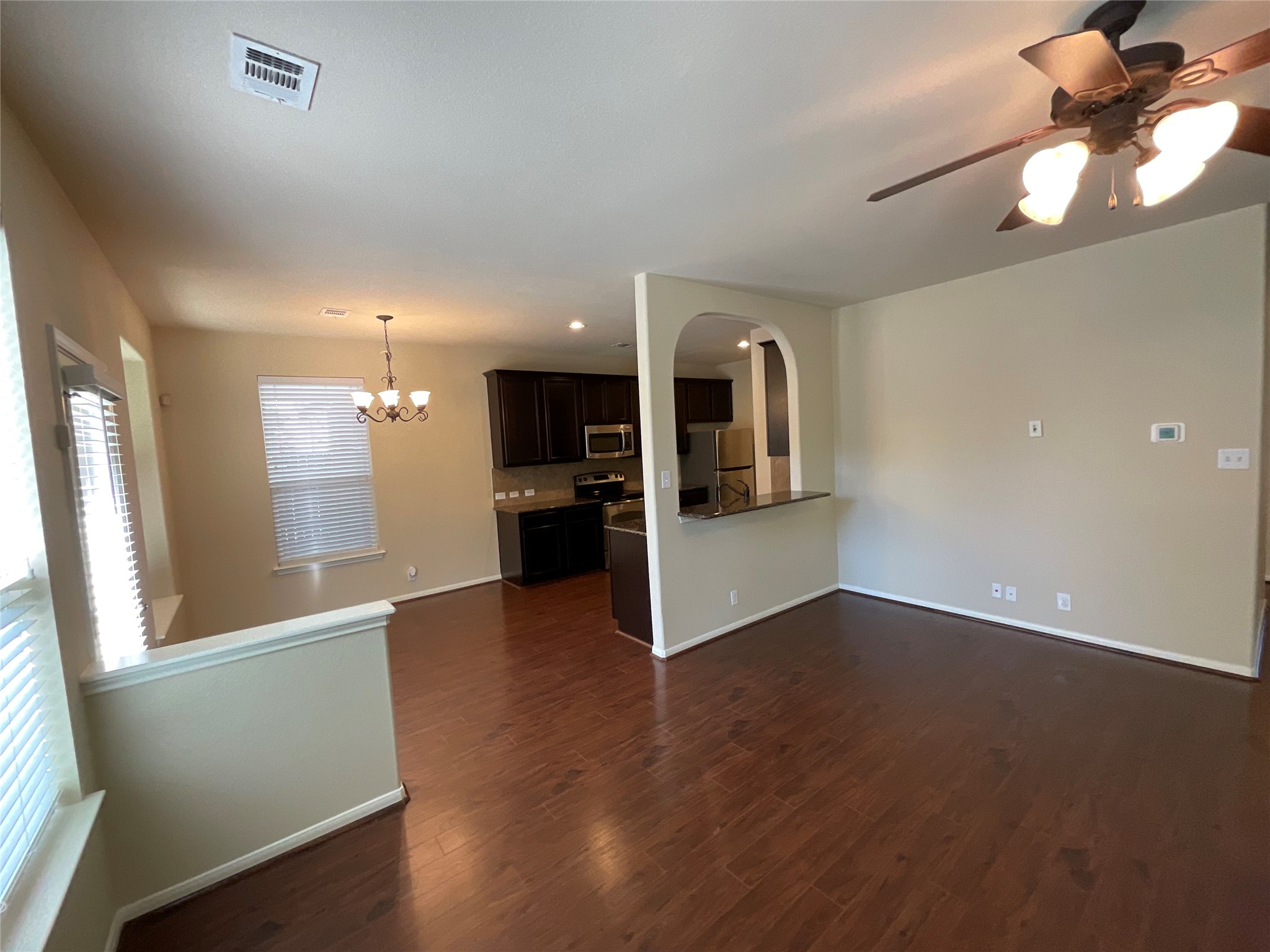 1911 Conn Creek Road Cedar Park, TX 78613 - Photo 12 of 39 a view of a kitchen with a sink and a refrigerator