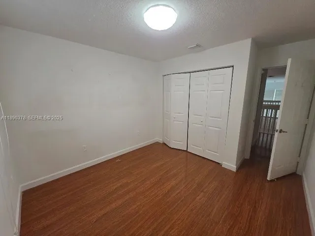 a view of a street with a yard