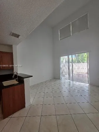 a view of a kitchen with a sink