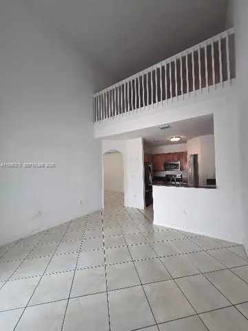a kitchen with granite countertop stainless steel appliances and a counter top space